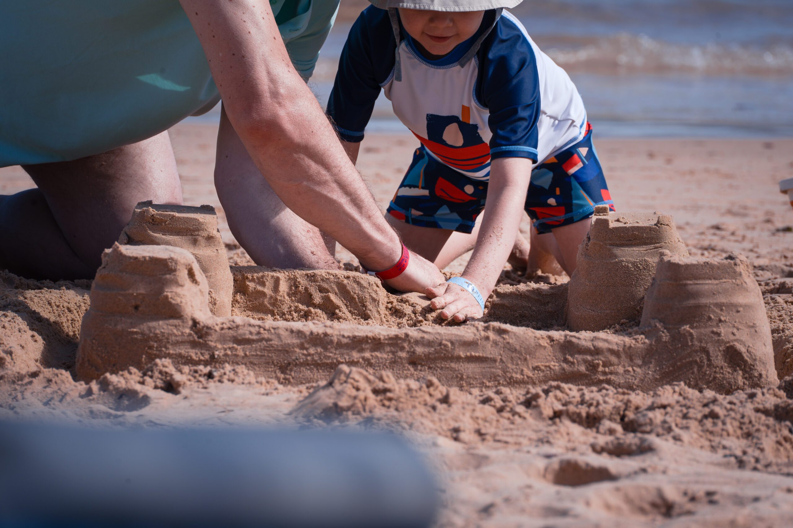 sandcastle building with grandpa
