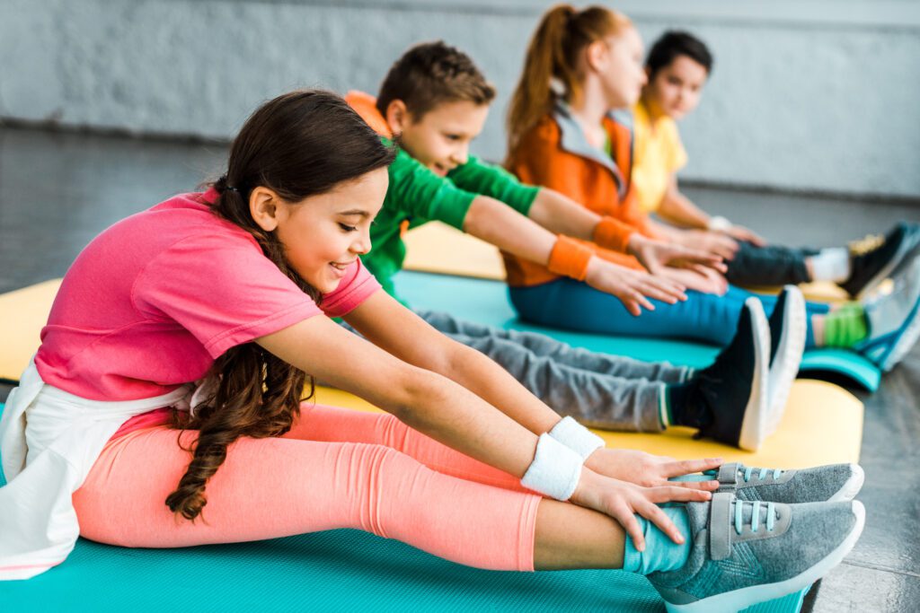 Group of kids stretching together to burn off some energy